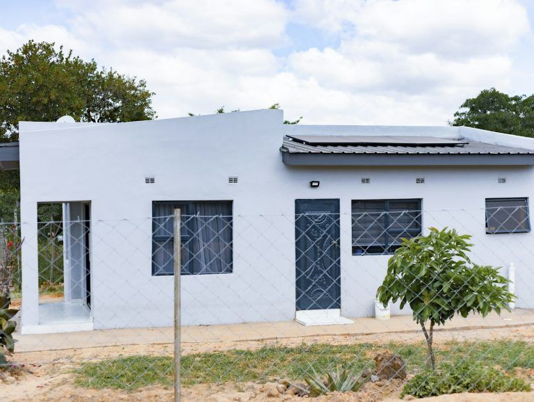 Small house with solar panels on the roof