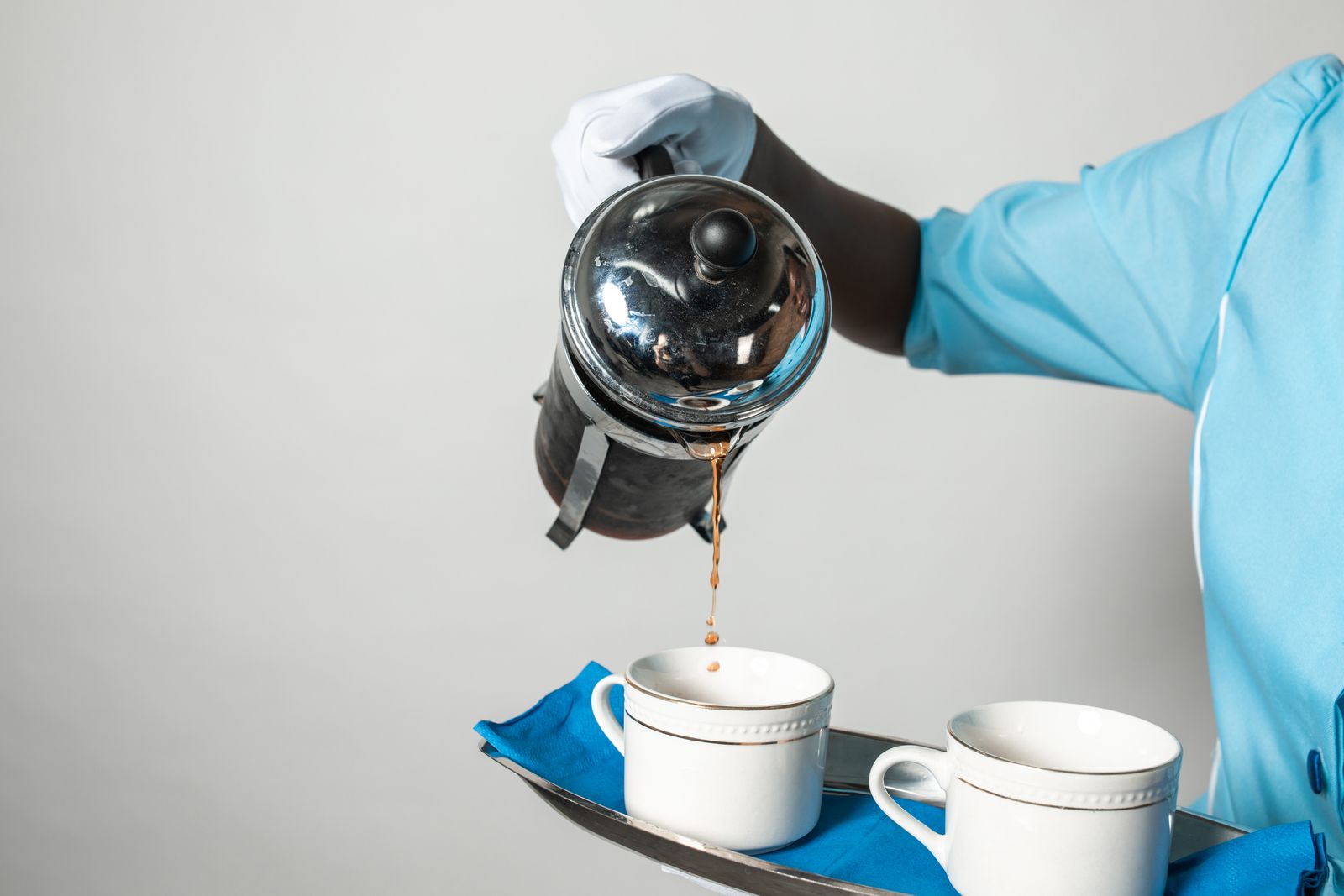 Coffee being poured from a French press