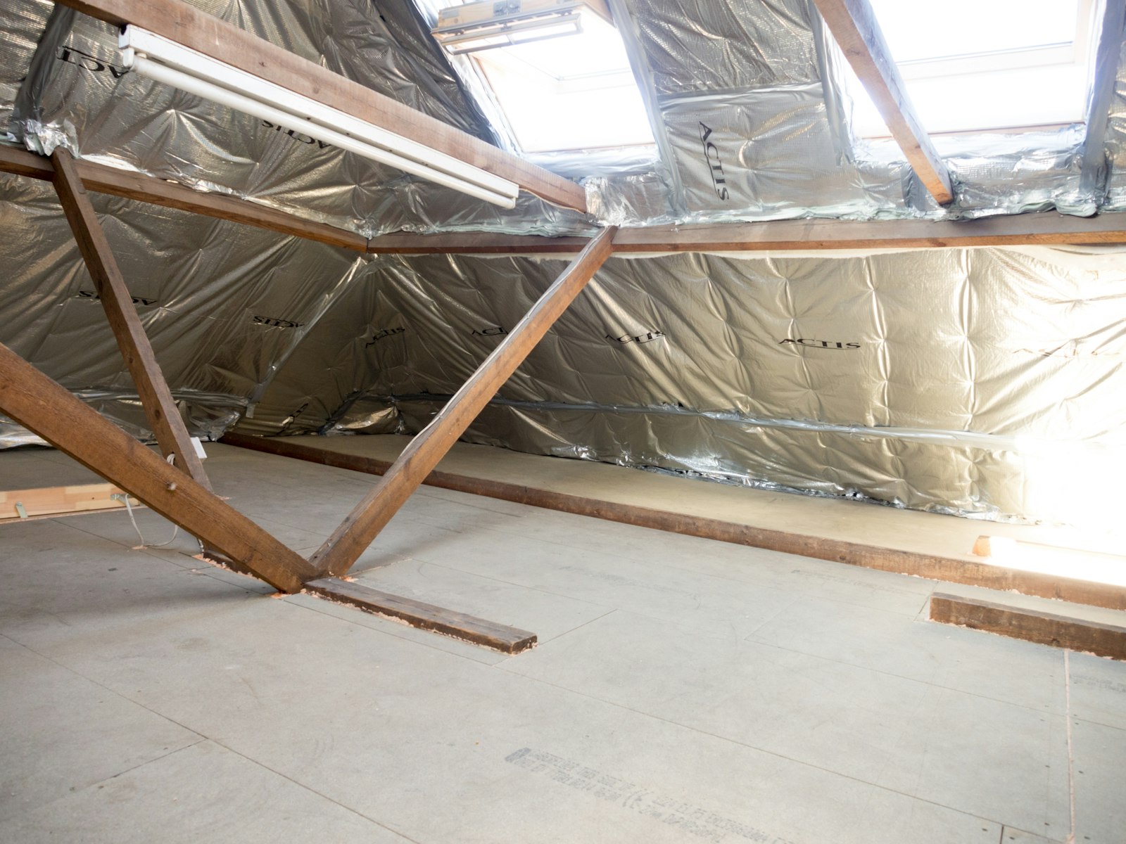 Insulated attic with wooden beams