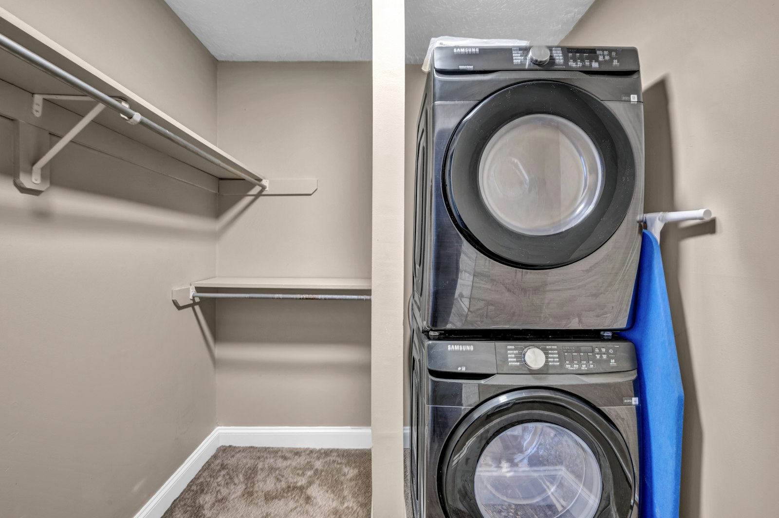 Stacked washer and dryer in a laundry closet