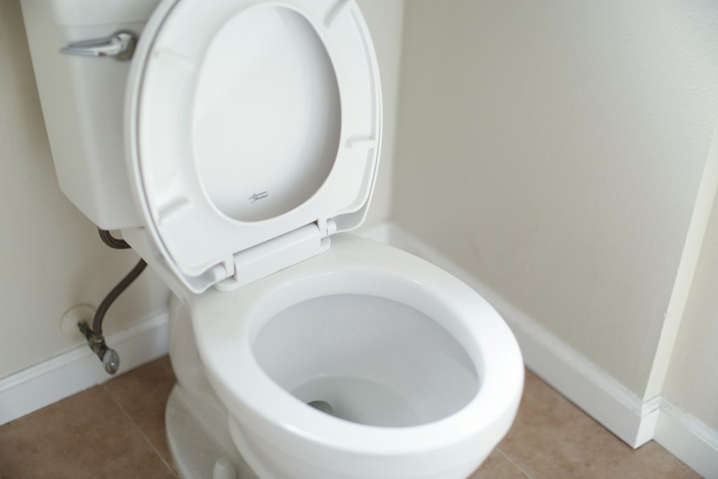 Toilet with a closed lid in a bathroom