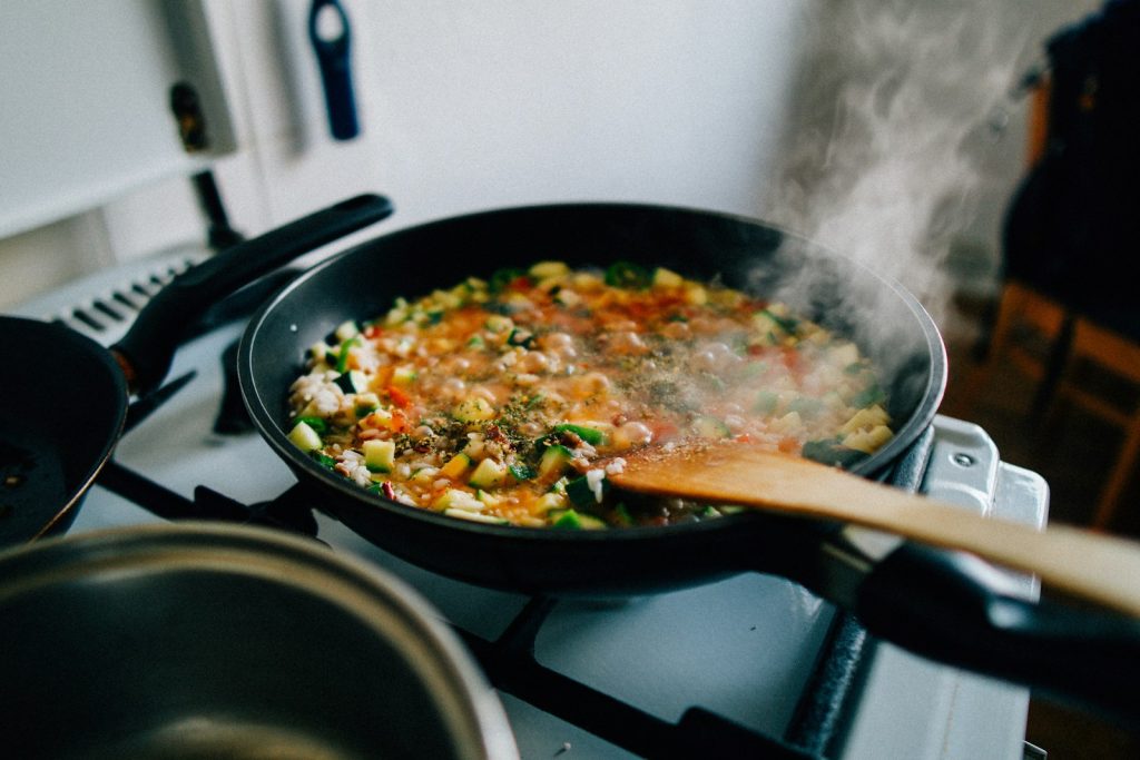 Pan of food cooking on a stovetop