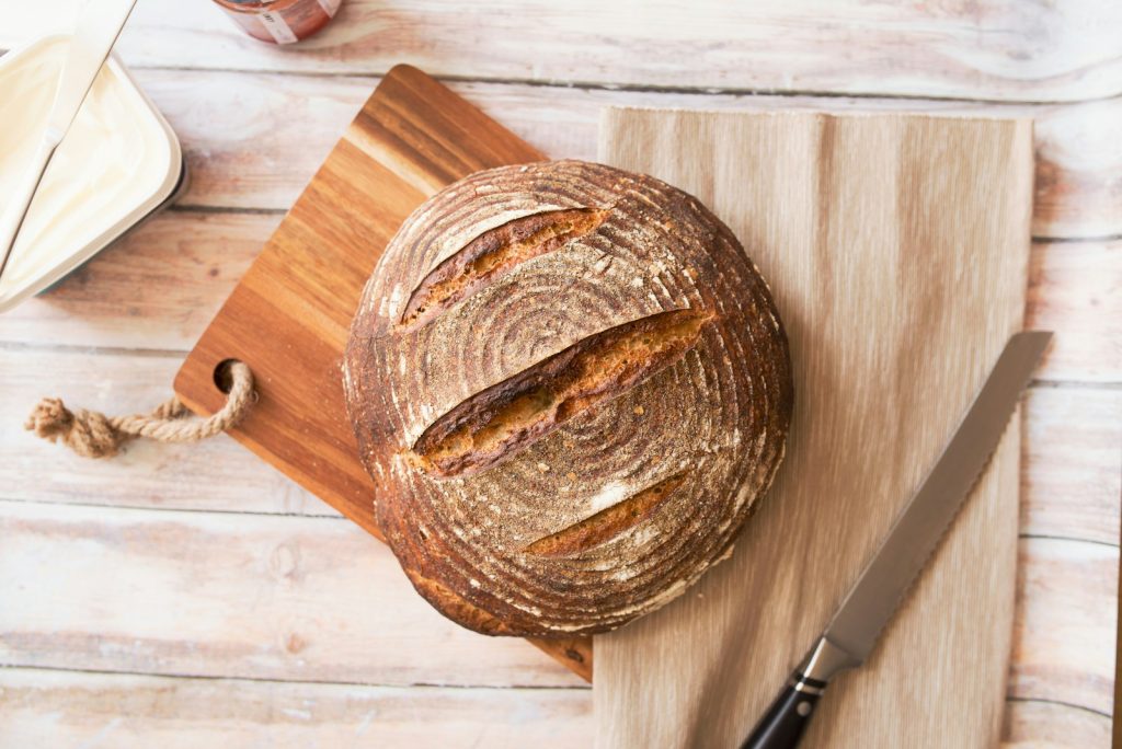 Loaf of fresh bread on a wooden board