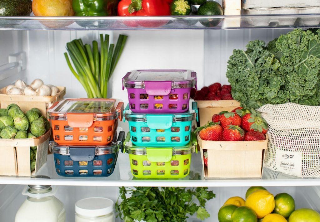Food containers neatly stacked inside a refrigerator