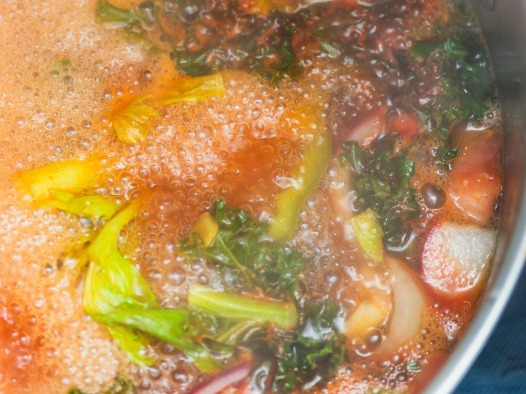 Vegetable broth simmering in a pot