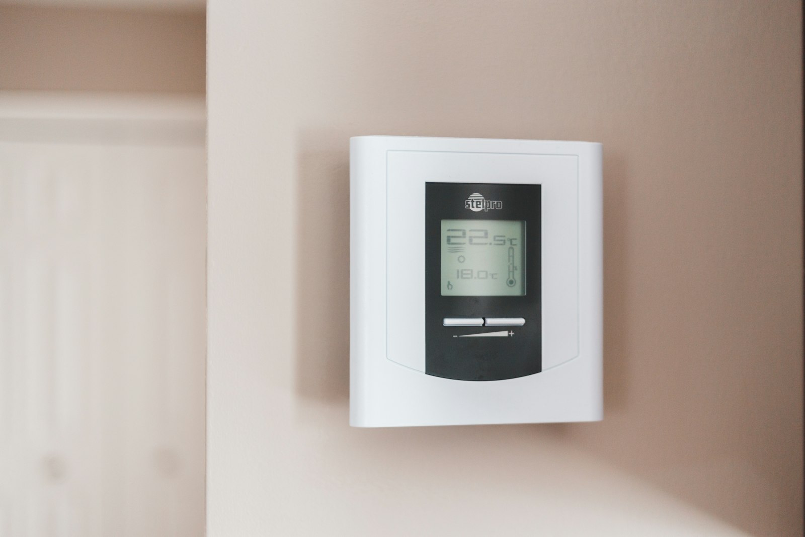 Programmable wall thermostat