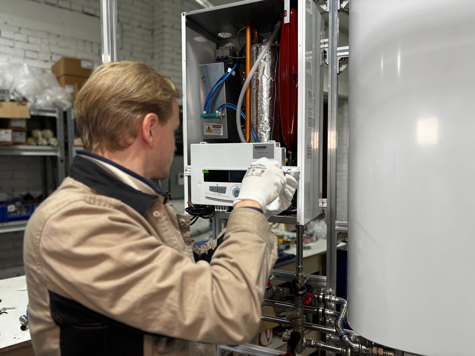 Technician servicing a home water heating system