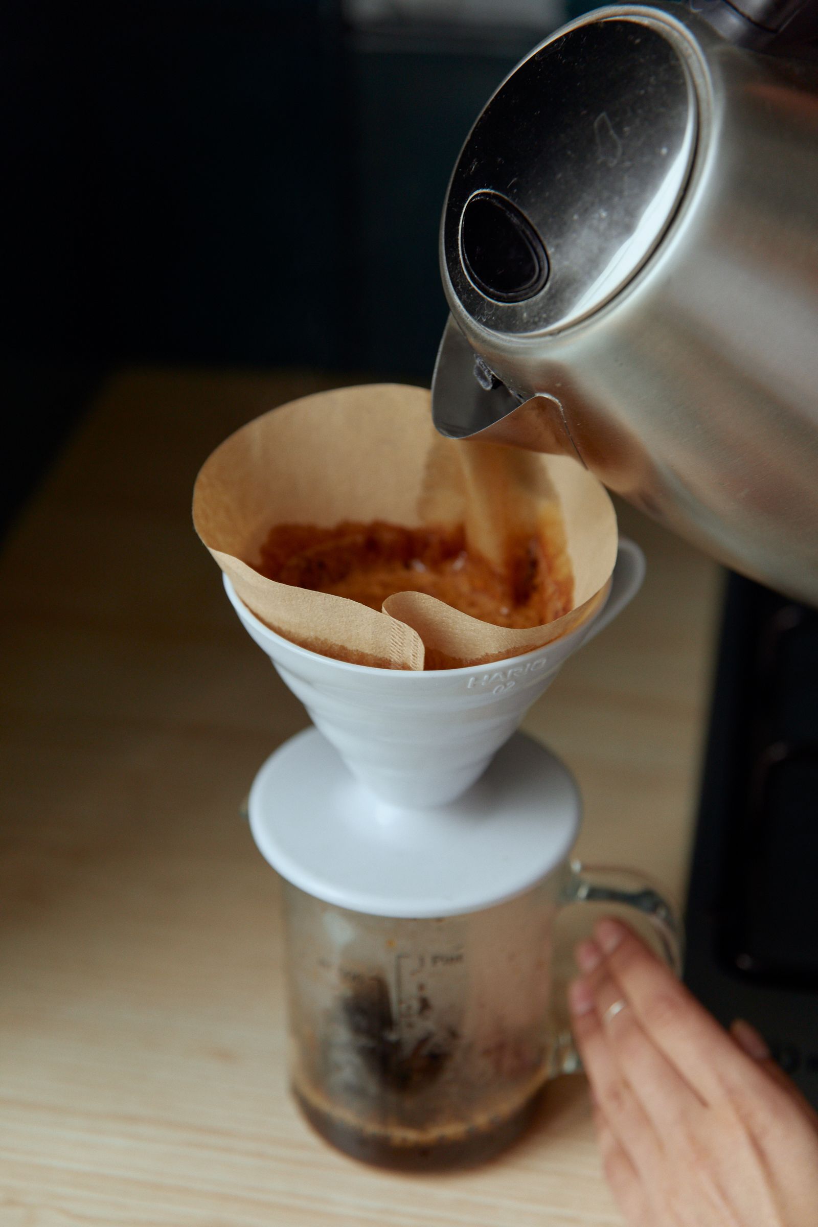 Hot water poured over coffee in a reusable filter cone